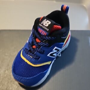New Balance Kids Sneakers in Blue with Red and Yellow Accents